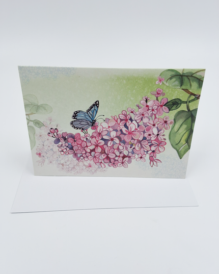 Wenskaart vlinder op bloementak