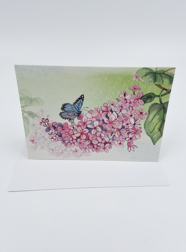 Wenskaart vlinder op bloementak