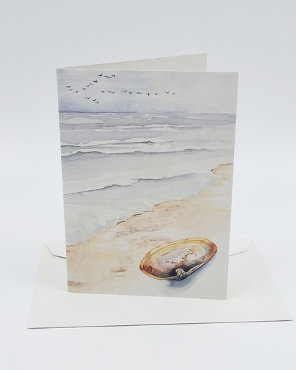 Wenskaart strand met schelp