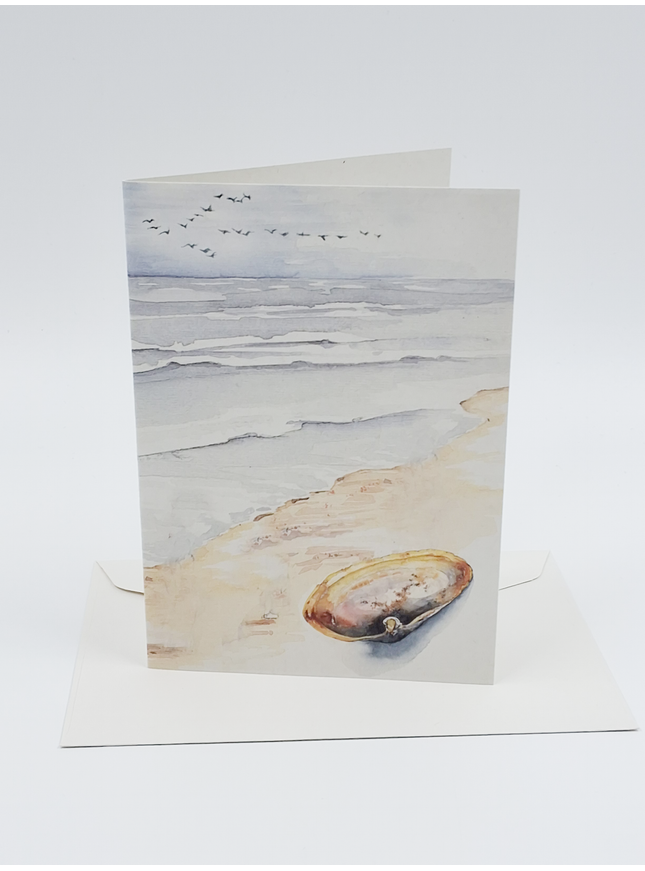 Wenskaart strand met schelp
