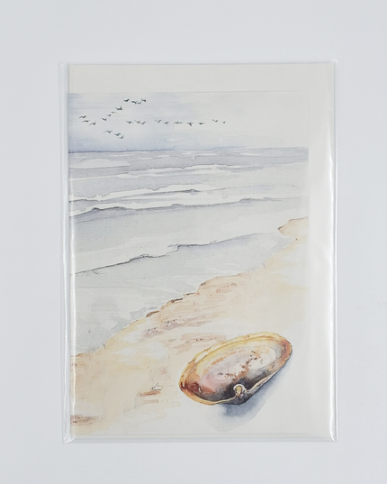 Wenskaart strand met schelp