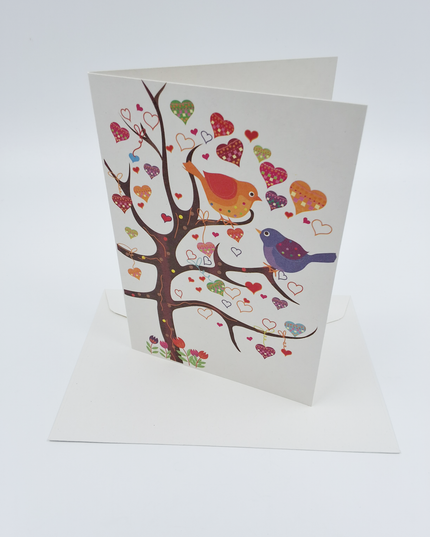 Wenskaart boom vogels hartjes