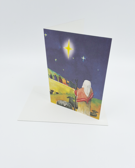 Kerstkaart herder kijkt naar wijzen