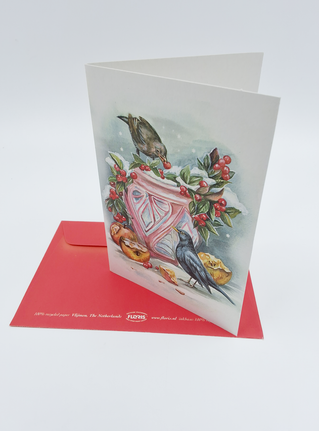 Wenskaart bloempot in sneeuw met merels