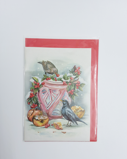 Wenskaart bloempot in sneeuw met merels