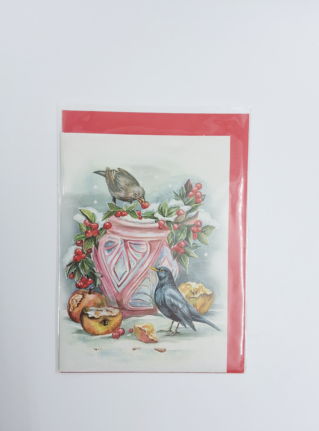 Wenskaart bloempot in sneeuw met merels